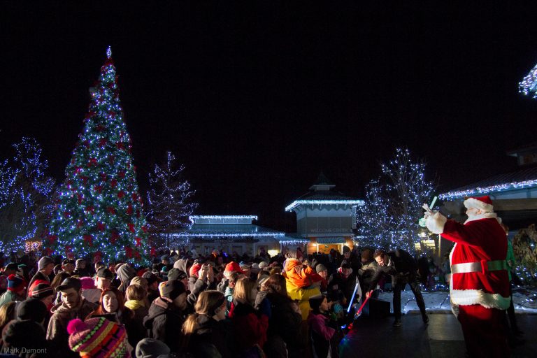 santa waving a crowd at cincinatti zoo festival of lights - photo by cincinatti zo