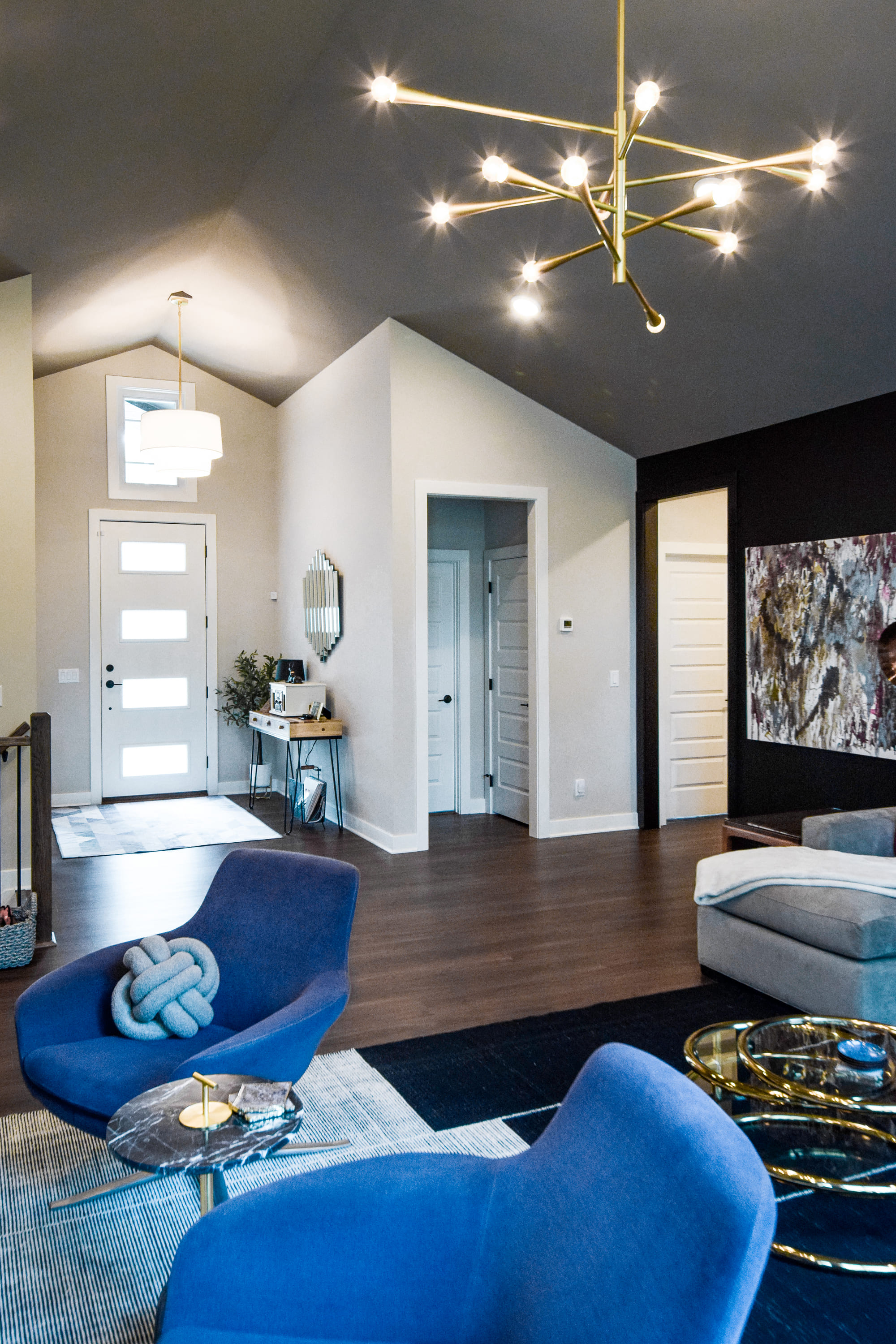 modern living room with gold light fixture by Chris Gorman Homes in Cincinnati