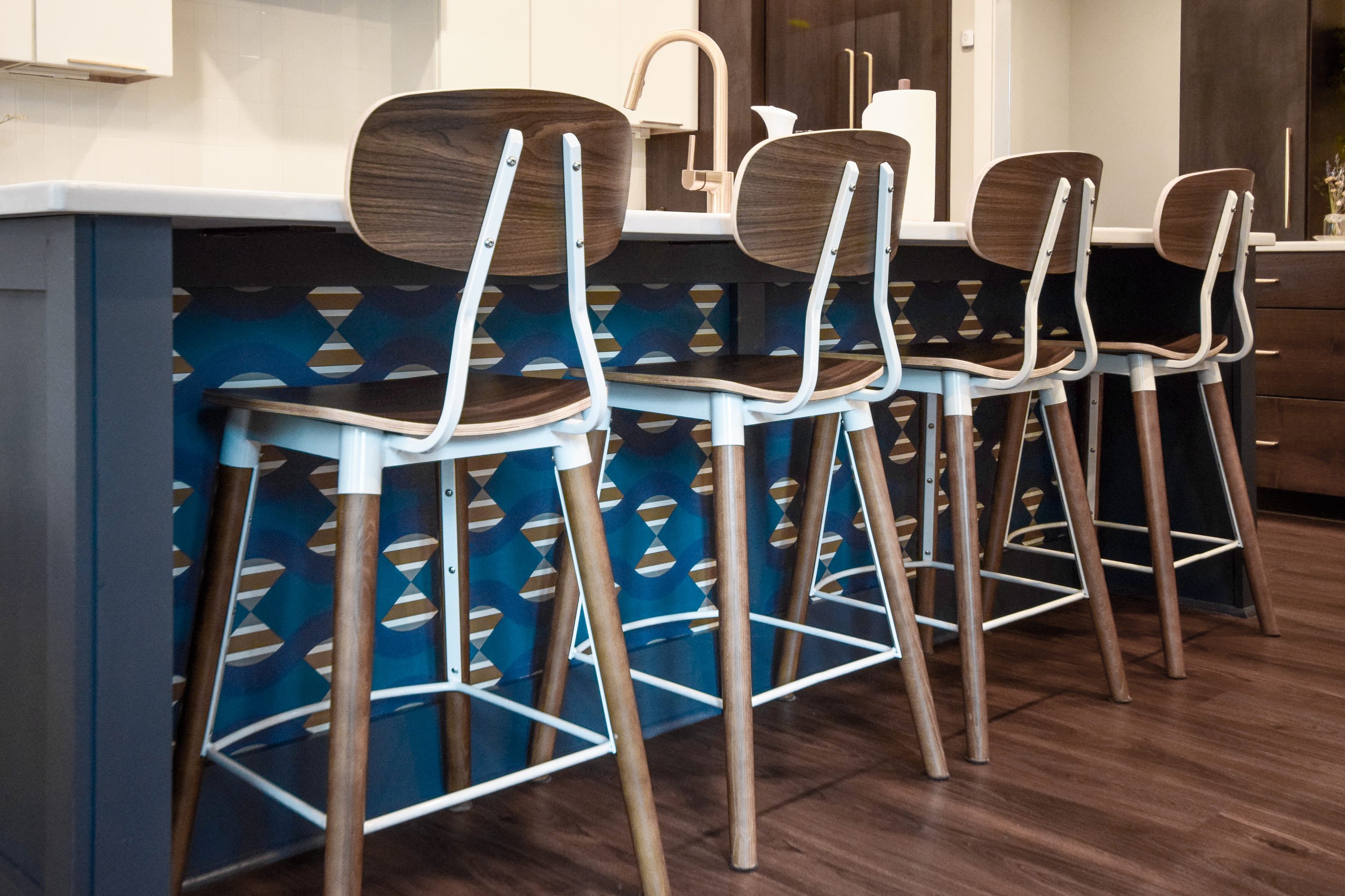 blue wall along bar stools in kitchen by Chris Gorman Homes in Cincinnati